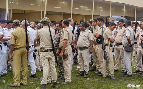 Security personnel outside polling station.